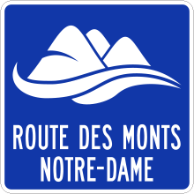 Direction to the Route sign (Route des Monts Notre-Dame)