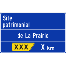 Présignalisation de sortie vers un site patrimonial (La Prairie)