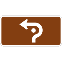 Panonceau de direction à gauche (carrefour giratoire)